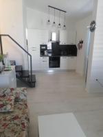 Kuchyň nebo kuchyňský kout v ubytování Apartments Mirela