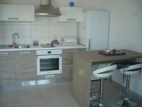 Kuchyň nebo kuchyňský kout v ubytování Apartments Mirela