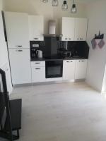 Kuchyň nebo kuchyňský kout v ubytování Apartments Mirela