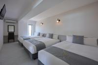 Hotel & Villa Seahorse MIYAKOJIMAにあるベッド
