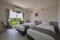 Hotel & Villa Seahorse MIYAKOJIMAにあるベッド