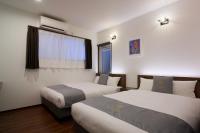 Hotel & Villa Seahorse MIYAKOJIMAにあるベッド
