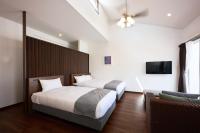 Hotel & Villa Seahorse MIYAKOJIMAにあるベッド