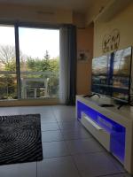 Televízia a/alebo spoločenská miestnosť v ubytovaní Appartement moderne aux Pavillons-sous-Bois - 24 m² + Terrasse