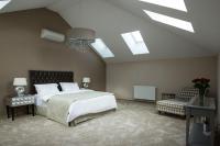 A bed or beds in a room at Vienna Suites