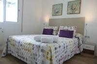 Postel nebo postele na pokoji v ubytování DELUX apartament Salou