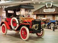an old red car is on display in a museum at Wedgewood Resort in Fairbanks