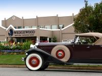 an old black car parked in front of a building at Wedgewood Resort in Fairbanks