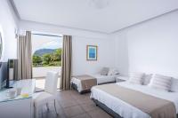 Posteľ alebo postele v izbe v ubytovaní Peninsula Resort & Spa