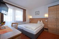 Łóżko lub łóżka w pokoju w obiekcie Pension Gabi