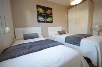 Postel nebo postele na pokoji v ubytování Livingtarifa Apartamento Los Lances