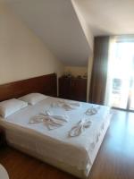 A bed or beds in a room at Guest House Skalite