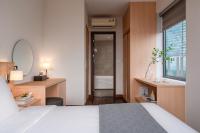 Keypad Hotel - Linh Langにあるベッド