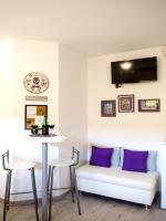 Televízia a/alebo spoločenská miestnosť v ubytovaní Apartment Onyx