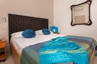 A bed or beds in a room at G House Rimini Spiaggia