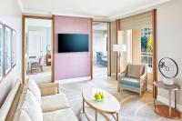 a living room with a couch and a tv at The Ritz-Carlton, Sarasota in Sarasota