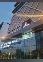 a building with a coffee bean sign on it at Elysium Capital Oasis! Opposite to Centaurus Mall in Islamabad