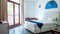 Postel nebo postele na pokoji v ubytování Silver Oasis Maldives