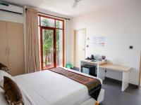 Postel nebo postele na pokoji v ubytování Silver Oasis Maldives