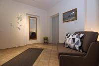 A seating area at Appartement Dallavia