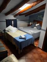 Postel nebo postele na pokoji v ubytování Hotel Casa de la Fuente