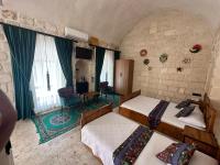 Postel nebo postele na pokoji v ubytování Sikeft Otel