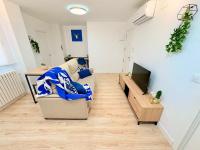 TV a/nebo společenská místnost v ubytování VIP -Apartamentos Birdie-