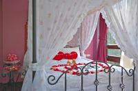 a bedroom with a bed with hearts on it at Full House Homestay in Yuchi