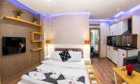 A bed or beds in a room at Taksim Trend Residence