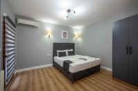A bed or beds in a room at Taksim Trend Residence