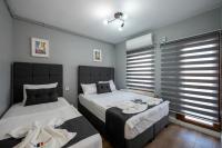 A bed or beds in a room at Taksim Trend Residence