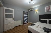 A bed or beds in a room at Taksim Trend Residence