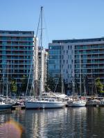 a group of boats docked in a harbor with buildings at Ramada by Wyndham Belfast in Belfast