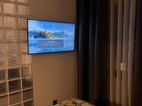 Televízia a/alebo spoločenská miestnosť v ubytovaní ROOM 11 Aristotelous Thessaloniki and-Mykonos