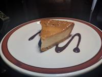 a piece of chocolate cake on a white plate at Hgen Rooms & Suites in Los Mochis