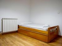 Postel nebo postele na pokoji v ubytování Apartamentos Jaca Ciudadela 3000