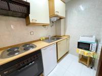 Kuchyň nebo kuchyňský kout v ubytování Apartamentos Jaca Ciudadela 3000