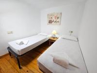 Postel nebo postele na pokoji v ubytování Apartamentos Jaca Ciudadela 3000