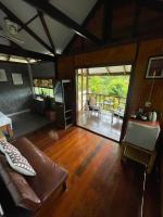 a living room with a couch and a table at Oon Lee Bungalows in Ko Jum