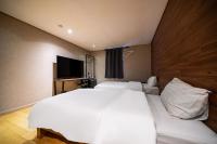 Incheon Airport Hotel Seattleにあるベッド