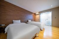 Incheon Airport Hotel Seattleにあるベッド