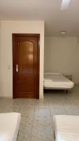Posteľ alebo postele v izbe v ubytovaní Hostal la Embajada
