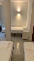 Posteľ alebo postele v izbe v ubytovaní Hostal la Embajada