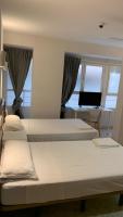 Posteľ alebo postele v izbe v ubytovaní Hostal la Embajada