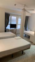 Posteľ alebo postele v izbe v ubytovaní Hostal la Embajada