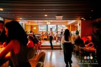 a group of people walking around a restaurant at L7 Chicago by LOTTE in Chicago