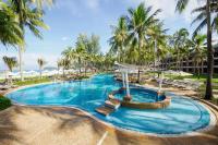 a pool at a resort with palm trees at Katathani Phuket Beach Resort - SHA Extra Plus in Kata Beach