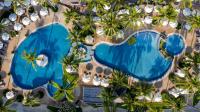 an overhead view of a swimming pool with palm trees at Katathani Phuket Beach Resort - SHA Extra Plus in Kata Beach