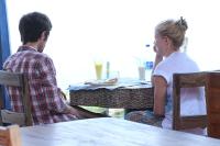 a man and a woman sitting at a table at Ginger House Museum Hotel in Cochin