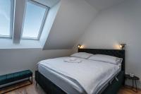 Postel nebo postele na pokoji v ubytování Residence Krušec